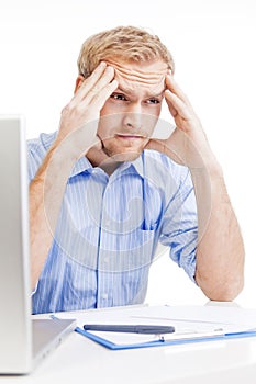 Young man at office thinking