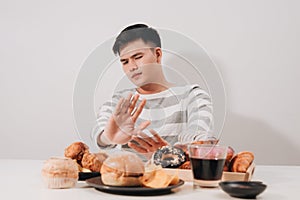 Young man in dieting and healthy eating concept