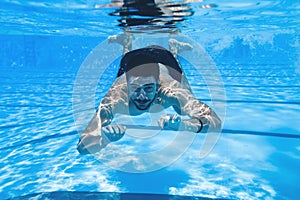 Young man diving in pool