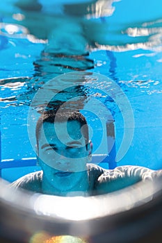 Young man diving in pool