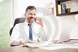 Young man doing business over the phone