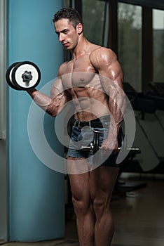 Young Man Doing Exercise For Biceps