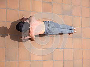 Young man doing exercise push-up