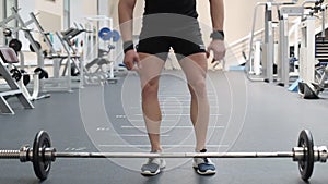 Young man doing exercises in a gym