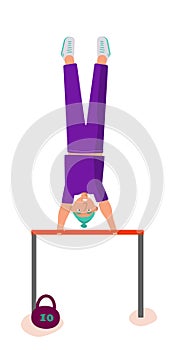 Young man doing gymnastic swing on horizontal bar.