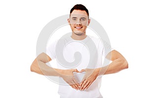 Young man doing heart gesture
