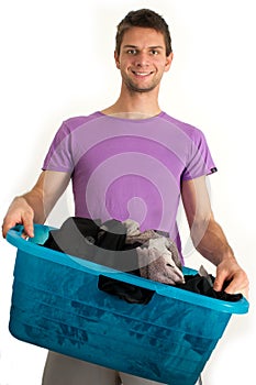 Young man doing the laundry