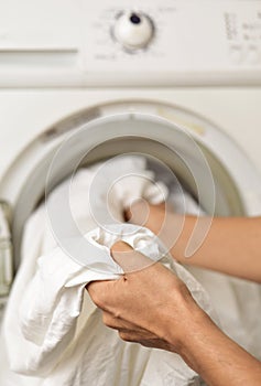 Young man doing laundry