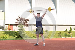 Young Man Doing A Overhead Squat Exercise Outdoor