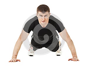 Young man doing push up exercise.