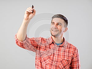 Young man drawing with marker