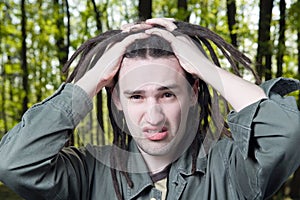 Young man with dreadlock hair.