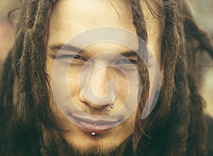 Young man with dreadlocks