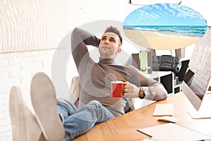 Young man dreaming about vacation at table