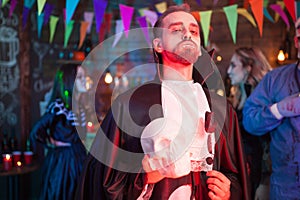 Young man dressed as vampire at Halloween party