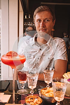 Young Man Drinking Cocktail in Hong Kong