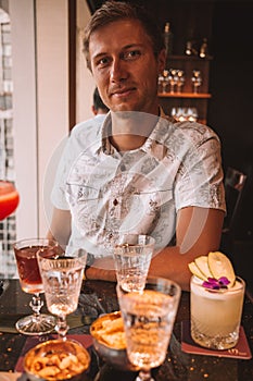 Young Man Drinking Cocktail in Hong Kong