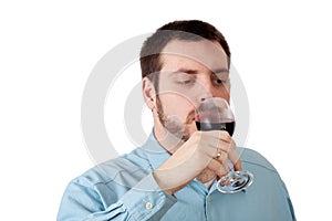 Young man drinking red wine