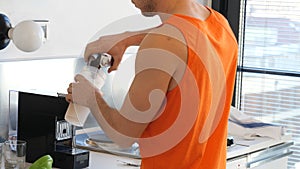 Young man drinking a smoothie drink or a protein shake