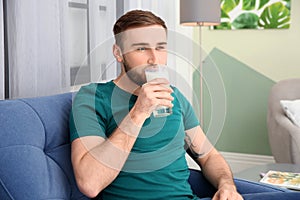 Young man drinking tasty milk