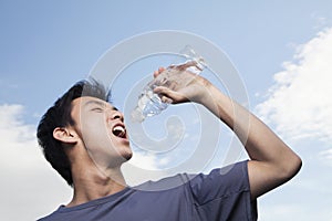 Young Man Drinking Water