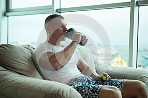 Young Man Drinking Water From Bottle