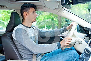 Young man driving car