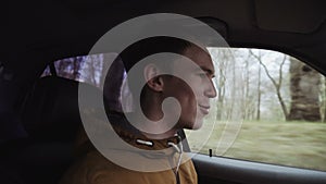 Young man driving a car. Inside shot