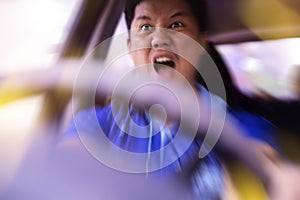 Young man driving a car shocked about to have traffic accident