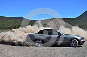 Young Man Driving and Drifting a Mustang