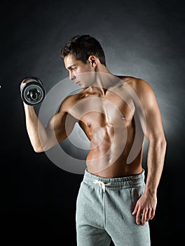 Young man with dumbbell