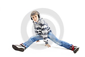 Young man with ear-phones dancing hip-hop