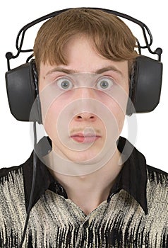 Young man in ear-phones with protruding eyes