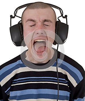 Young man in earphones loudly sings