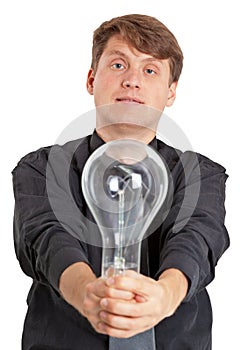 Young man with electric bulb in hands