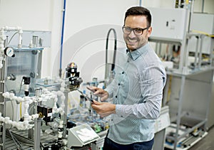 Young man in the electronic workshop