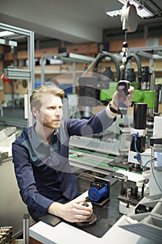 Young man in electronics workshop