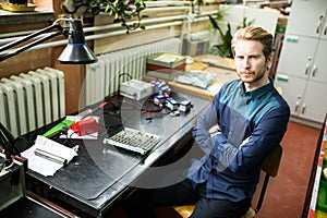 Young man in electronics workshop