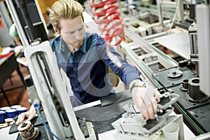 Young man in electronics workshop