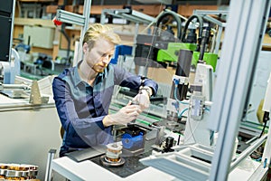 Young man in electronics workshop