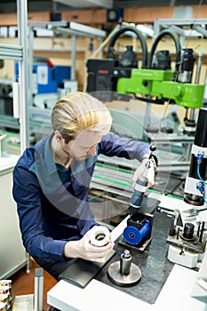 Young man in electronics workshop