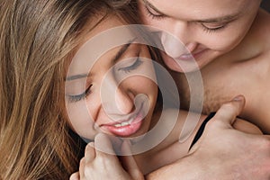 Young man embraces girl