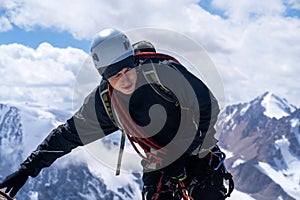 Young man is engaged in mountaineering.