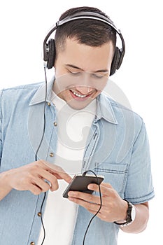 Young man enjoy listening music on mobilephone with headphones