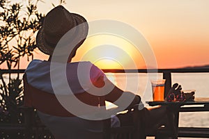 Young man enjoying at a beach bar