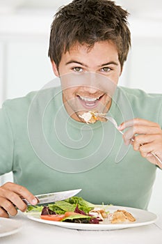 Young Man Enjoying A Healthy Meal