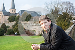 Young man enjoying spring sunshine in a German city