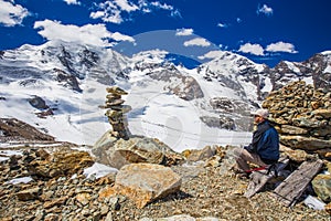 Young man enjoying the stunning view of Morteratsch glacier