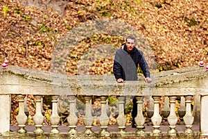 A young man enjoys wildlife during the golden autumn. The concept of solitude with nature