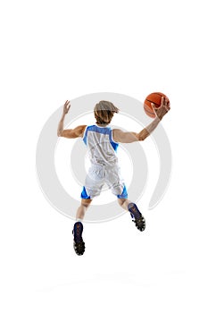 Young man, enthusiastic basketball player inn motion with ball, preparing for upcoming game,training isolated on white